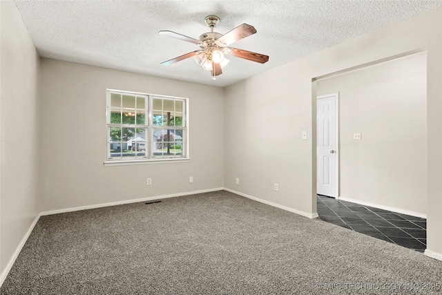 8508 E 123rd St S, Bixby, OK 74008 - spare room with dark colored carpet, ceiling fan, and a textured ceiling