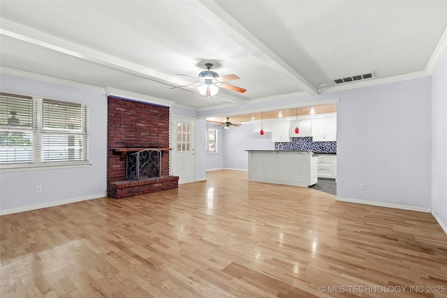 8508 E 123rd St S, Bixby, OK 74008 - unfurnished living room with a ceiling fan, baseboards, light wood finished floors, beamed ceiling, and ornamental molding