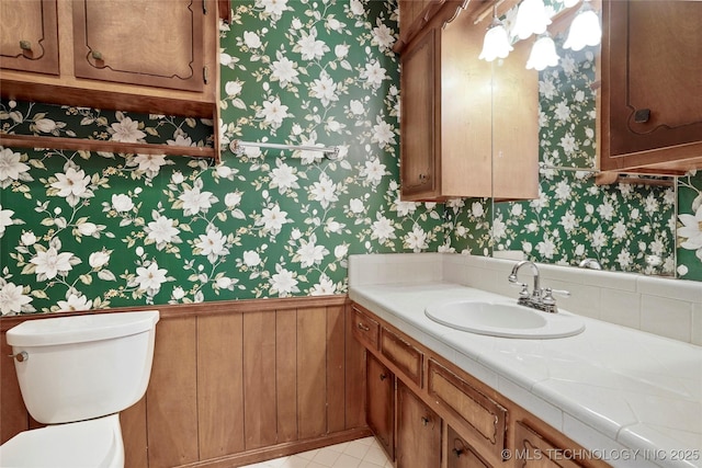 8508 E 123rd St S, Bixby, OK 74008 - half bathroom featuring wallpapered walls, toilet, and vanity