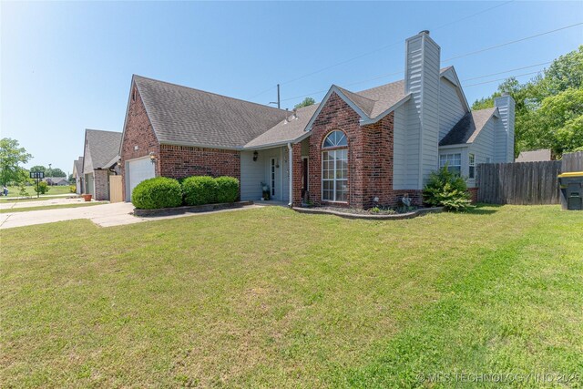11636 S 102nd E Ave, Bixby, OK 74008 - view of front facade with brick siding, an attached garage, roof with shingles, concrete driveway, and a chimney
