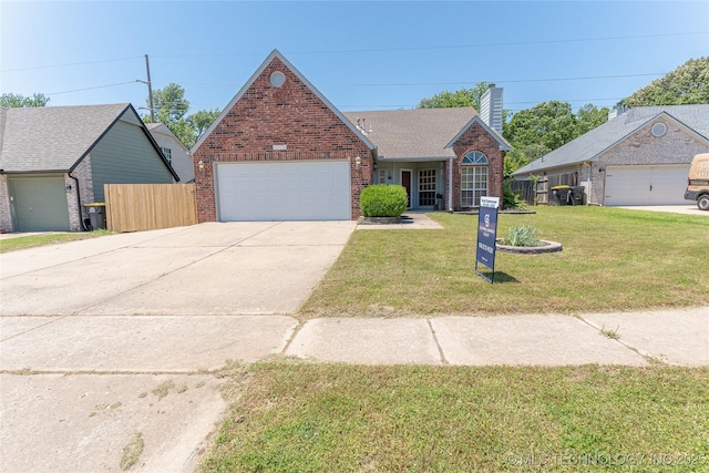 11636 S 102nd E Ave, Bixby, OK 74008 - view of front facade with brick siding, an attached garage, concrete driveway, and a chimney