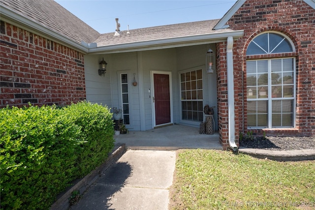11636 S 102nd E Ave, Bixby, OK 74008 - property entrance featuring a shingled roof and brick siding