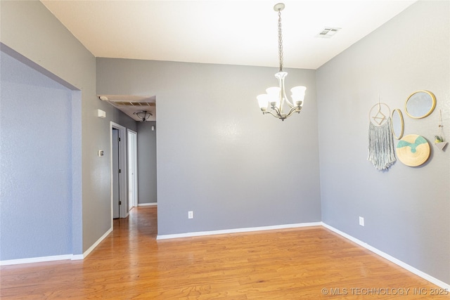 11636 S 102nd E Ave, Bixby, OK 74008 - unfurnished room featuring light wood-type flooring, a chandelier, and baseboards
