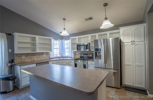 11636 S 102nd E Ave, Bixby, OK 74008 - kitchen with open shelves, appliances with stainless steel finishes, a sink, decorative backsplash, and lofted ceiling