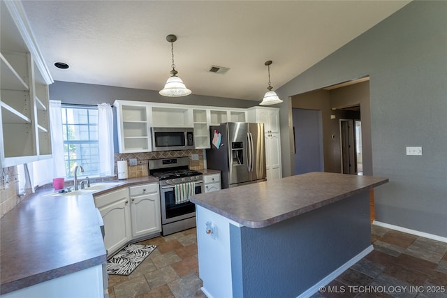 11636 S 102nd E Ave, Bixby, OK 74008 - kitchen with appliances with stainless steel finishes, a sink, open shelves, stone tile floors, and lofted ceiling