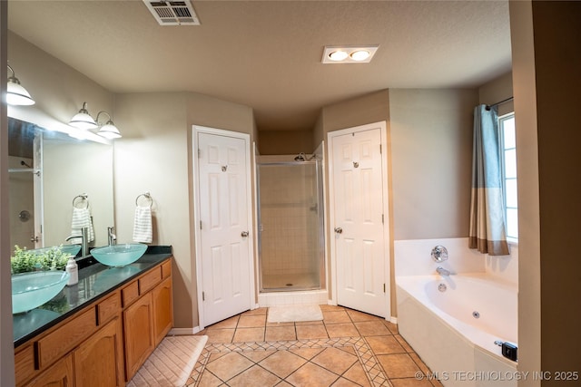 11636 S 102nd E Ave, Bixby, OK 74008 - full bath featuring tile patterned floors, a stall shower, a garden tub, double vanity, and baseboards