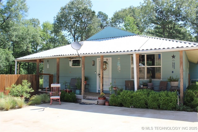 423118 E 1944th Ln, Antlers, OK 74523 - rear view of house featuring a porch, fence, and metal roof
