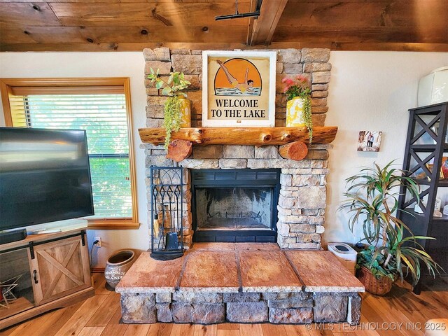 35824 S Talon Dr, Cookson, OK 74427 - living area with wood finished floors, wooden ceiling, beam ceiling, and a fireplace