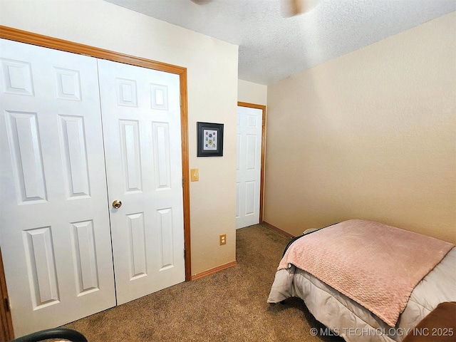 35824 S Talon Dr, Cookson, OK 74427 - bedroom featuring dark carpet, baseboards, a textured ceiling, and a ceiling fan