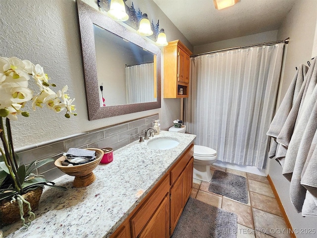 35824 S Talon Dr, Cookson, OK 74427 - full bathroom featuring vanity, toilet, and tasteful backsplash