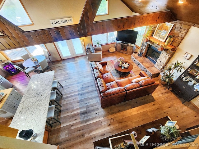 35824 S Talon Dr, Cookson, OK 74427 - living area featuring wood-type flooring, a fireplace, healthy amount of natural light, and high vaulted ceiling