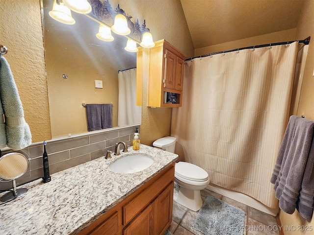35824 S Talon Dr, Cookson, OK 74427 - bathroom featuring vaulted ceiling, a textured wall, toilet, vanity, and decorative backsplash