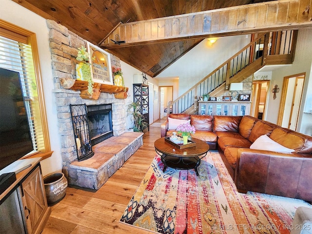 35824 S Talon Dr, Cookson, OK 74427 - living room with wood ceiling, wood-type flooring, stairway, high vaulted ceiling, and a stone fireplace