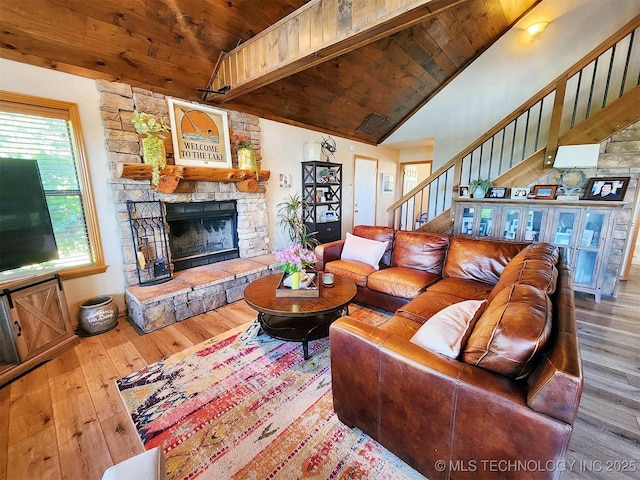 35824 S Talon Dr, Cookson, OK 74427 - living room featuring wooden ceiling, hardwood / wood-style floors, stairs, a stone fireplace, and high vaulted ceiling