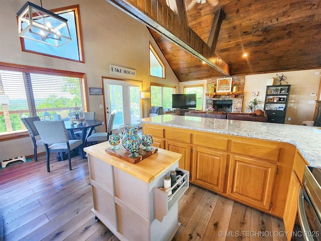 35824 S Talon Dr, Cookson, OK 74427 - kitchen featuring high vaulted ceiling, open floor plan, wooden ceiling, a stone fireplace, and light wood-style floors