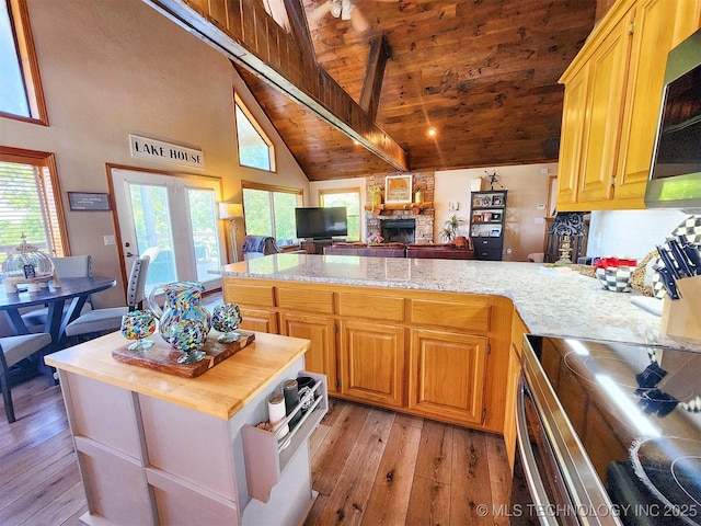 35824 S Talon Dr, Cookson, OK 74427 - kitchen with appliances with stainless steel finishes, a peninsula, light wood-style flooring, wood ceiling, and high vaulted ceiling