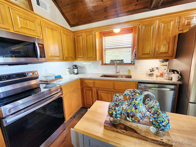 35824 S Talon Dr, Cookson, OK 74427 - kitchen with stainless steel appliances, a sink, wood ceiling, wood finished floors, and decorative backsplash