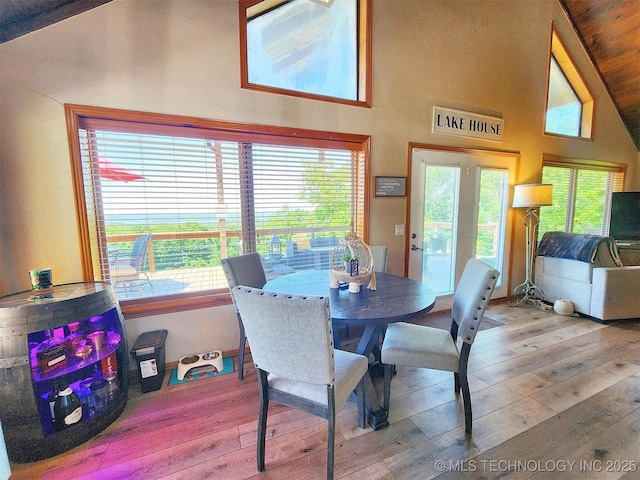 35824 S Talon Dr, Cookson, OK 74427 - dining area featuring wood-type flooring, high vaulted ceiling, and plenty of natural light