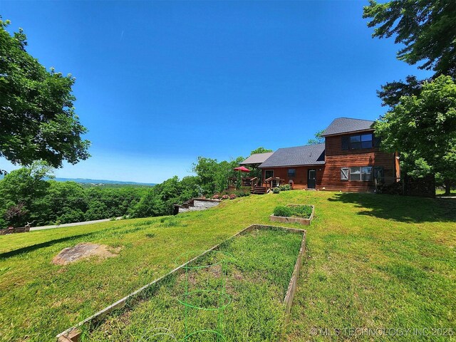 35824 S Talon Dr, Cookson, OK 74427 - view of green lawn featuring a vegetable garden