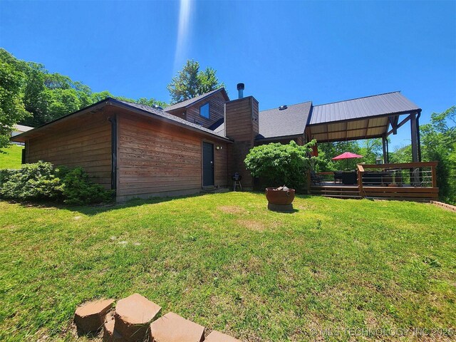 35824 S Talon Dr, Cookson, OK 74427 - rear view of property with a lawn, a chimney, and a deck