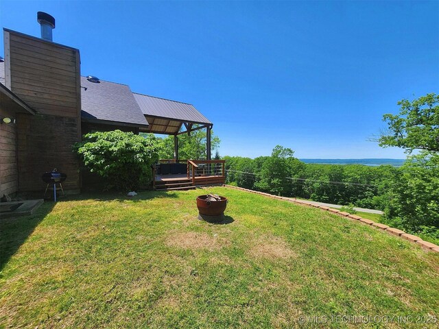 35824 S Talon Dr, Cookson, OK 74427 - view of grassy yard with an outdoor fire pit and a deck