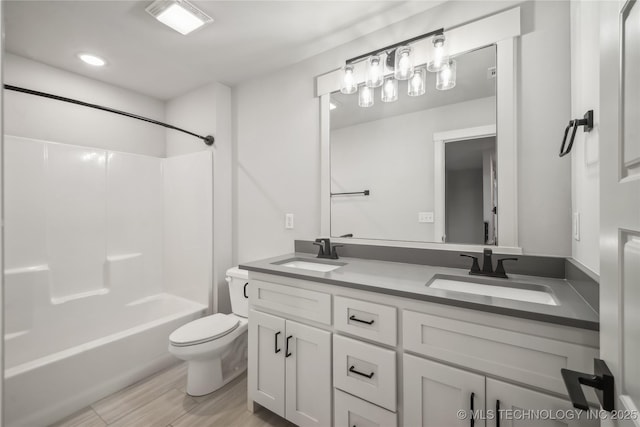 2044 E 138th Pl S, Bixby, OK 74008 - bathroom featuring toilet, double vanity, shower / tub combination, wood finished floors, and recessed lighting