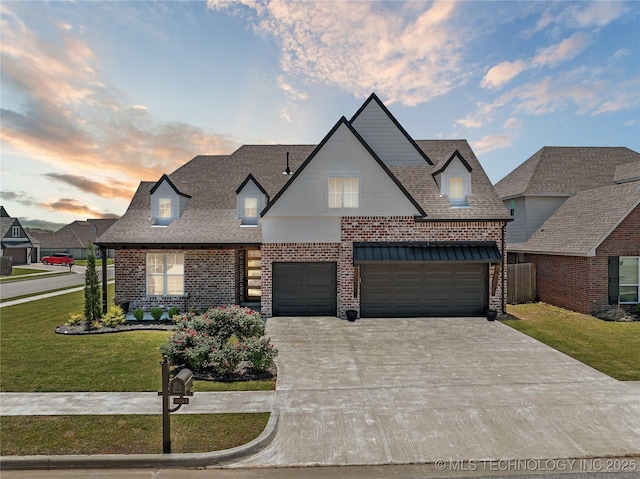 2044 E 138th Pl S, Bixby, OK 74008 - french country style house with brick siding, a lawn, concrete driveway, and a shingled roof