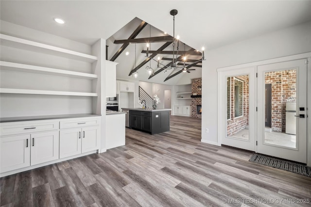 2044 E 138th Pl S, Bixby, OK 74008 - kitchen featuring a chandelier, appliances with stainless steel finishes, white cabinetry, a sink, and built in features