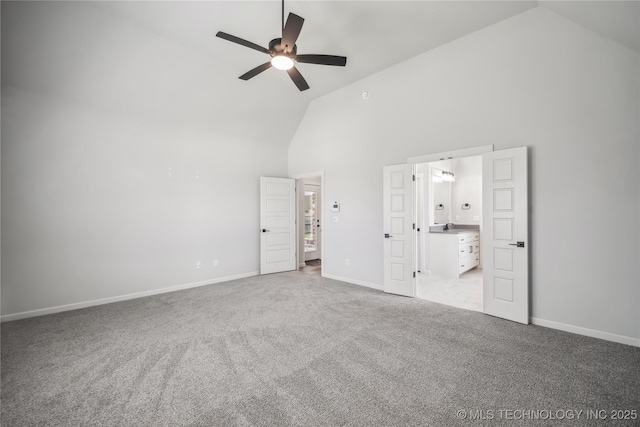 2044 E 138th Pl S, Bixby, OK 74008 - unfurnished bedroom with high vaulted ceiling, carpet flooring, baseboards, a sink, and a ceiling fan