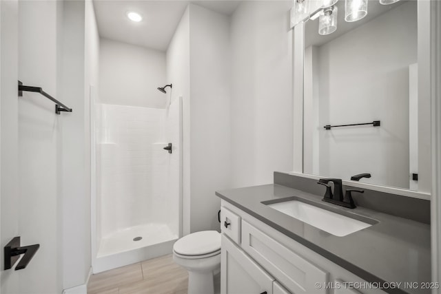 2044 E 138th Pl S, Bixby, OK 74008 - bathroom featuring a stall shower, toilet, vanity, and recessed lighting