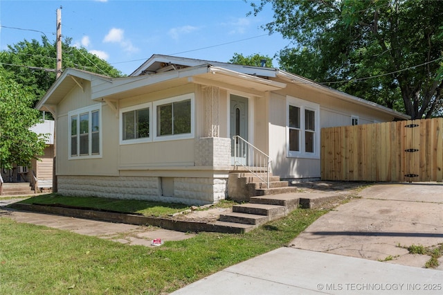 view of front of house with fence and entry steps