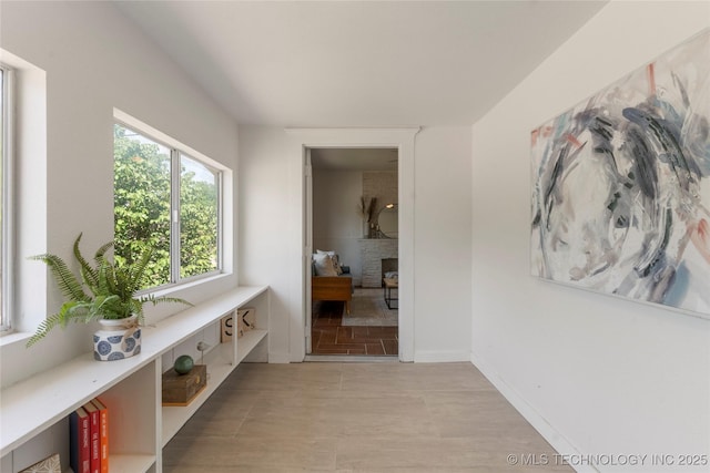 corridor featuring baseboards