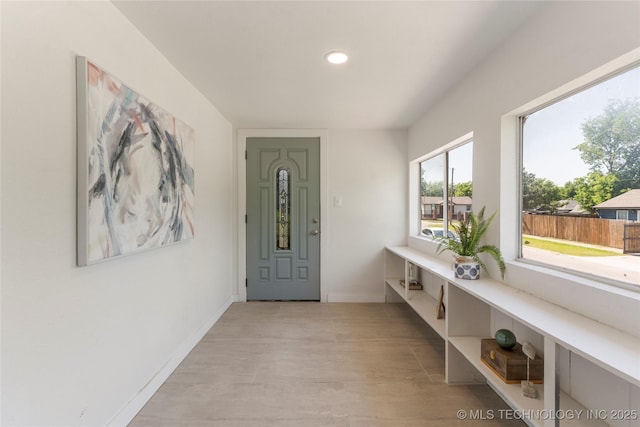 entryway with recessed lighting, baseboards, and light wood-type flooring