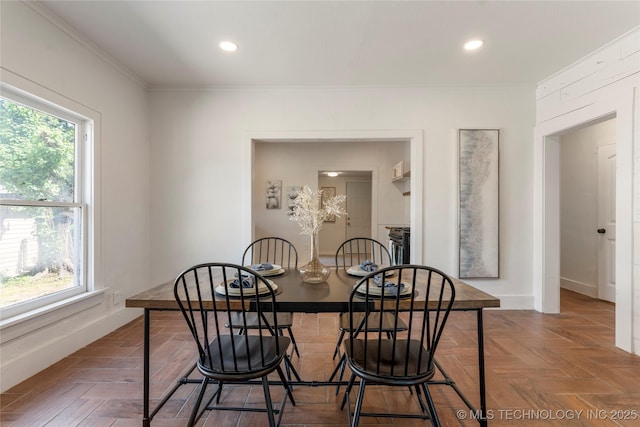 dining room featuring crown molding, recessed lighting, and baseboards