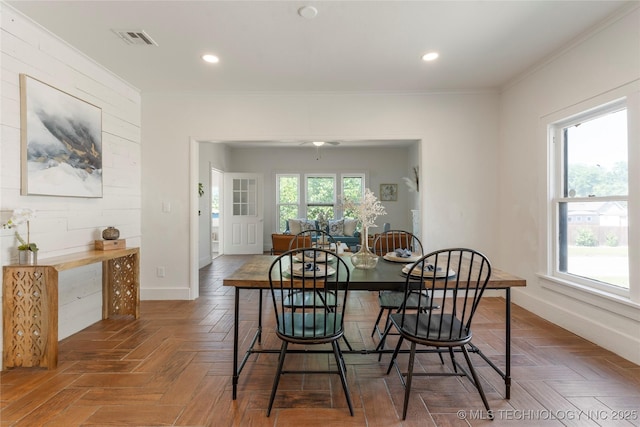 dining area featuring crown molding, baseboards, and recessed lighting