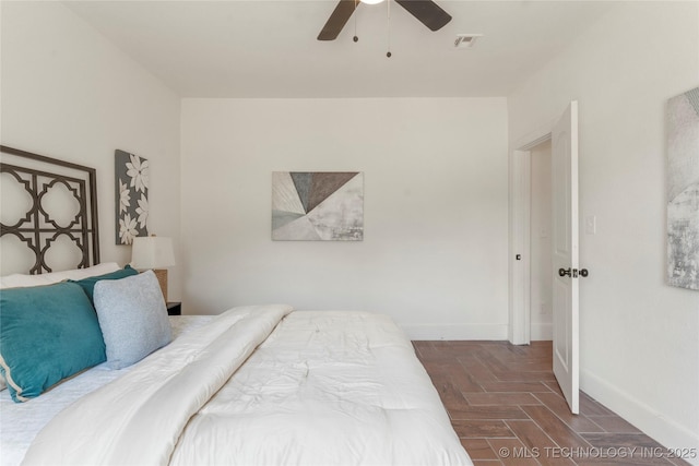 bedroom with baseboards and ceiling fan