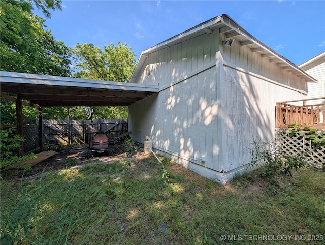 view of side of property with fence