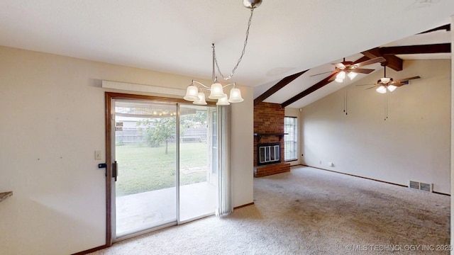 1703 Vaden Ln, Ardmore, OK 73401 - unfurnished dining area featuring carpet, baseboards, a chandelier, ceiling fan, and a brick fireplace