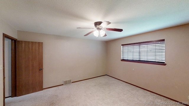 1703 Vaden Ln, Ardmore, OK 73401 - unfurnished room with carpet floors, a ceiling fan, and baseboards