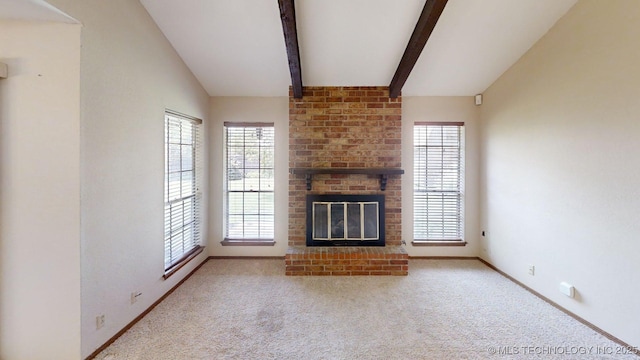1703 Vaden Ln, Ardmore, OK 73401 - unfurnished living room with healthy amount of natural light, baseboards, and carpet flooring