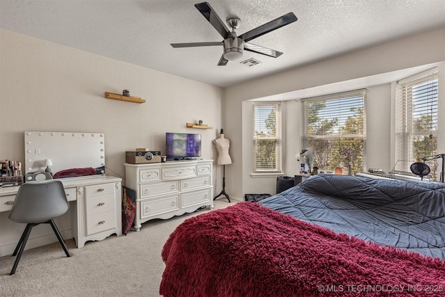 619 S Magnolia Pl, Broken Arrow, OK 74012 - bedroom with light carpet, a textured ceiling, an office area, and ceiling fan