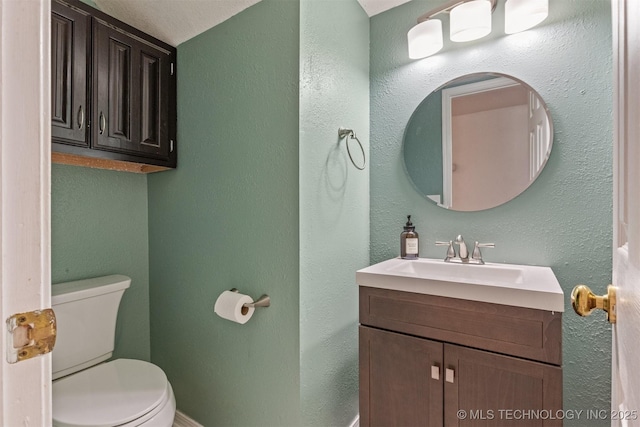 619 S Magnolia Pl, Broken Arrow, OK 74012 - half bath featuring toilet, vanity, and baseboards