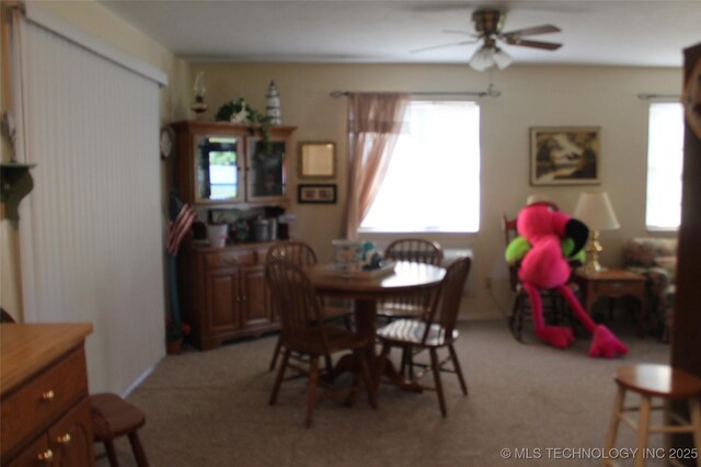 420902 E 1164th Rd, Eufaula, OK 74432 - dining space featuring light carpet and ceiling fan