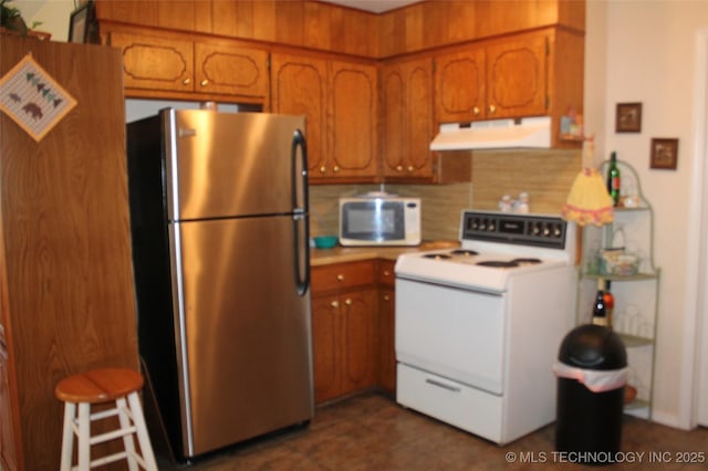 420902 E 1164th Rd, Eufaula, OK 74432 - kitchen with white appliances, extractor fan, brown cabinetry, tasteful backsplash, and light countertops