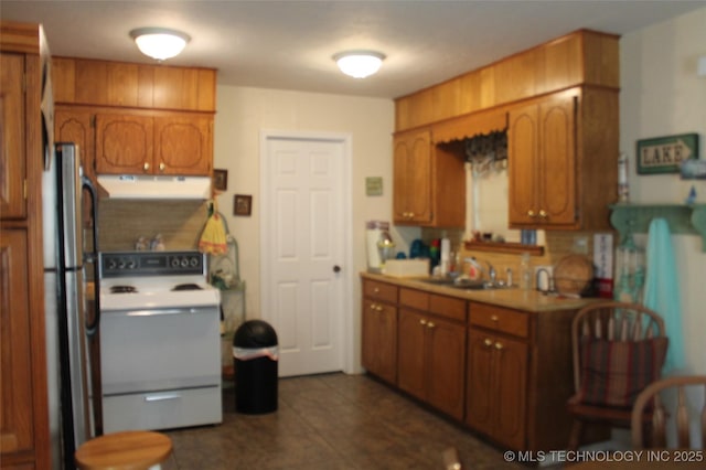 420902 E 1164th Rd, Eufaula, OK 74432 - kitchen with electric stove, exhaust hood, brown cabinetry, light countertops, and a sink