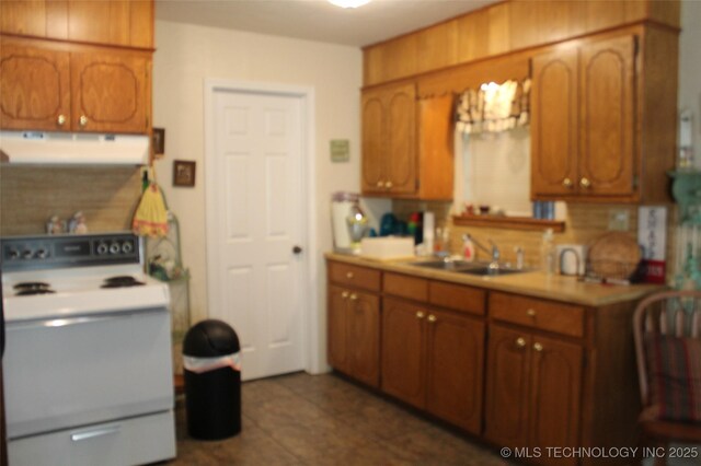 420902 E 1164th Rd, Eufaula, OK 74432 - kitchen with white range with electric stovetop, ventilation hood, a sink, and brown cabinetry