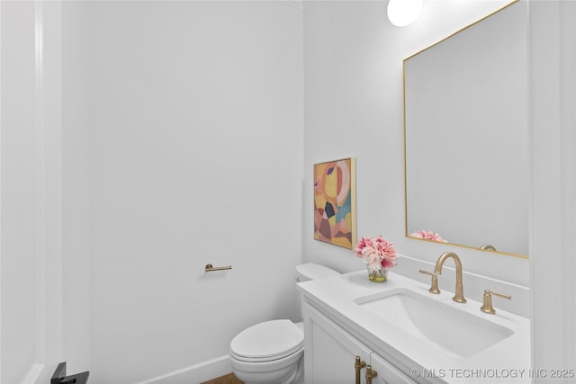 bathroom with toilet and vanity