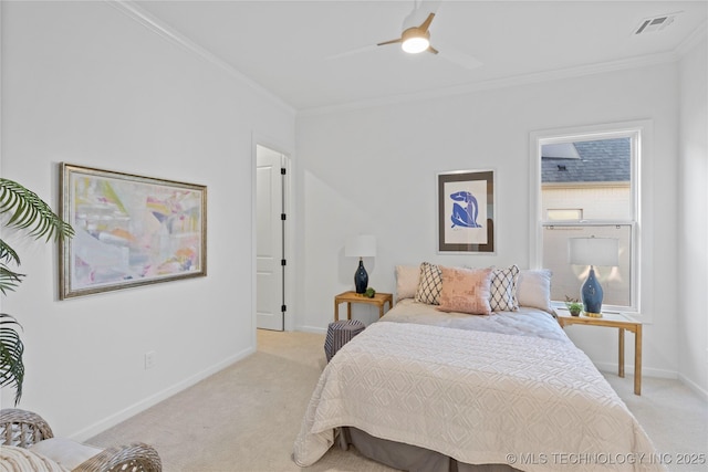 bedroom with light colored carpet, ornamental molding, baseboards, and a ceiling fan