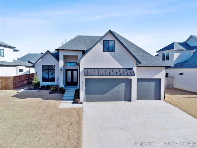 view of front facade with concrete driveway, a garage, a shingled roof, and stucco siding