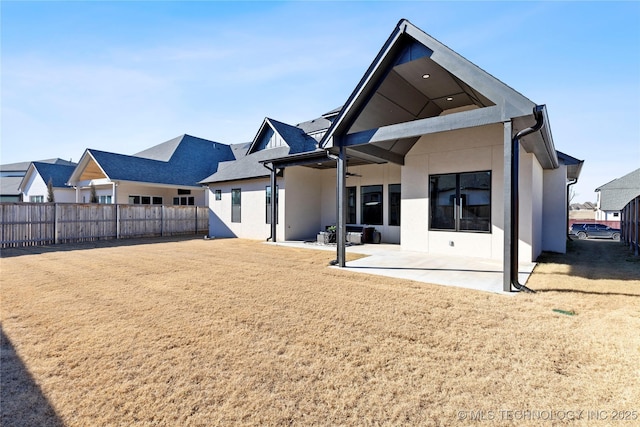 back of house featuring a patio area, fence, stucco siding, and ceiling fan